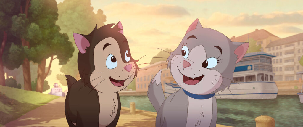 Ilustracja przedstawia dwa kotki na tle promenady przy rzece.